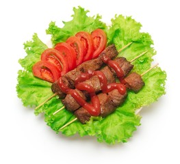 Shish kebab, tomato and green salad on white background.