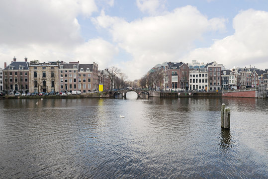 Amstel river canal in Amsterdam cityscape