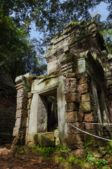 Naklejka premium Siem Reap, Cambodia - August 5th, 2016:Ta Prohm, part of Khmer temple complex, Asia. Siem Reap, Cambodia. Ancient Khmer architecture in jungle.ia. Ancient Khmer architecture in jungle.