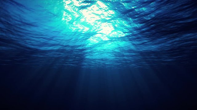 blue ocean surface seen from underwater, looped slow motion waves and beams, rays of sunlight shining through, 4K seamless loop animation
