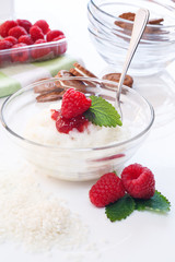 Milk Rice porridge with raspberry, white background light key