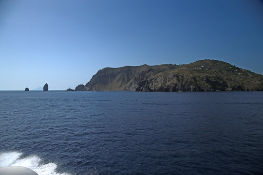 The Aeolian archipelago (UNESCO list), Italy. Lipari Island. On the left - the rocks of Pietra Lunga and Pietra Menalda