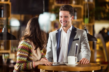Friends are having fun in the cafe after a busy day