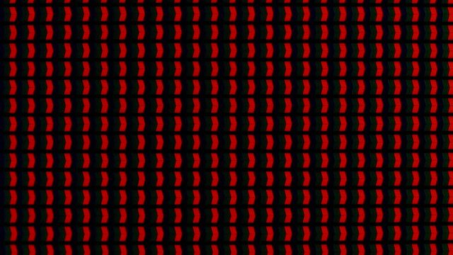 RGB macro pixels on the LED during broadcasting of the movie, close up.