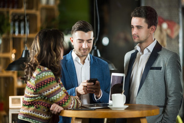 Friends working in cafe