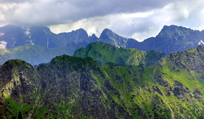 Poland, Tatra Mountains, Zakopane - Lodowy Szczyt, Jaworowe Szczyty, Swistowy, Zabi peaks under clouds and Lodowa Pass with High Tatra mountain range panorama in background