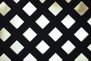 background squares. Black wooden grille