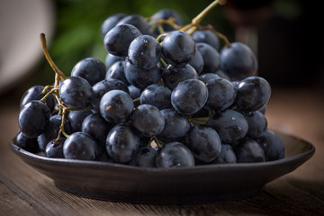 Dark grape in bowl.