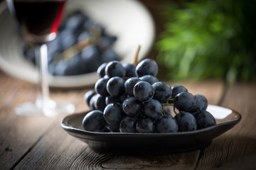 Dark grape in bowl.