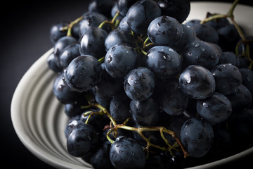 Dark grape in bowl.