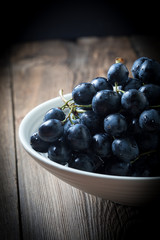 Dark grape in bowl.