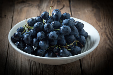 Dark grape in bowl.