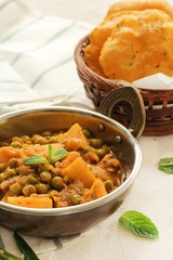 Alu Matar ( Aloo Mutter) served with Masala Puri or Poori