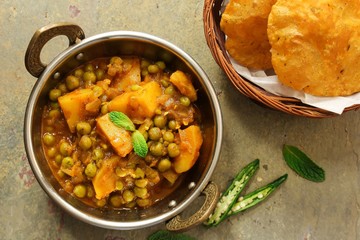 Alu Matar ( Aloo Mutter) served with Masala Puri or Poori