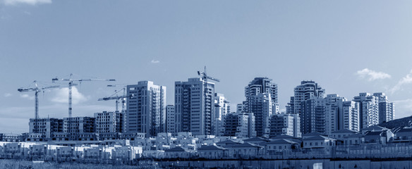 Fototapeta premium Banner - view of New Neighborhood - Concept of Modern Residential Buildings.Blue toned image