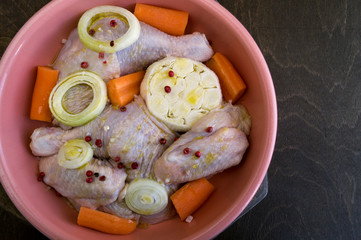 Raw chicken in the marinade with spices
