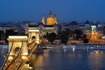 Fototapeta na wymiar Szechenyi chain bridge and Pest view with St. Stephen's Basilica at night, Budapest