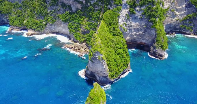 Aerial View Of The Nusa Penida Banah Cliffs - Direct Approaching View Of Tropical Coast With Tan Rocky Cliffs Overlooking Turquoise Blue Cove