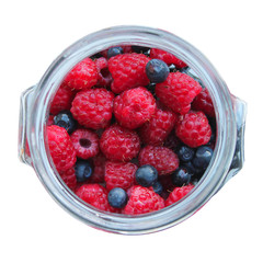 Berries in a jar on a white background