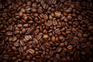 Close-up of roasted brown coffee beans background