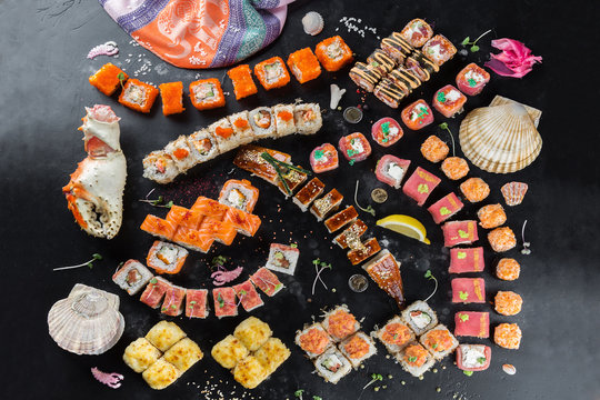 Various sushi rolls in set. Sushi restaurant menu, Japanese food, delicious seafood concept.