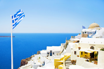 View of the village of Oia, Santorini, Greece. Traditional Greek architecture, white houses, the Aegean Sea, the caldera. White architecture against the blue sea