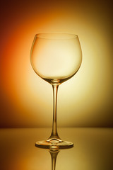 Wine glass blank on colorful abstract background.