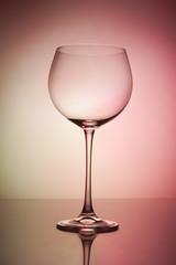 Wine glass blank on colorful abstract background.