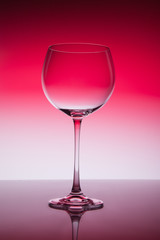 Wine glass blank on colorful abstract background.