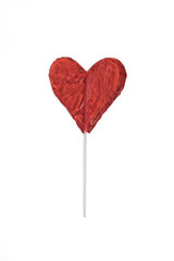the red Lollipop candy in heart shape onwhite background.
