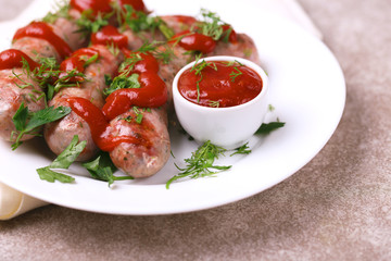 Grilled sausages with lime on iron grill pan