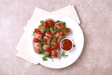Grilled sausages with lime on iron grill pan
