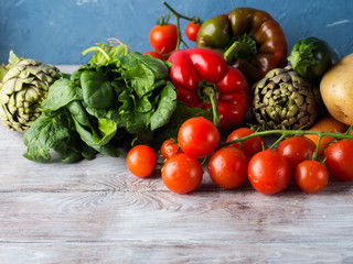 Assortment of fresh italian vegetables on wooden table