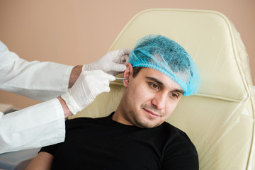 Man during otolaryngologist checkup