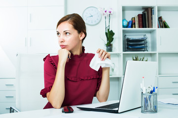 Depressed woman in office