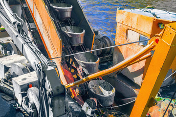 Fragments of conveyor endless chain of buckets - the digging element on bucket chain excavator