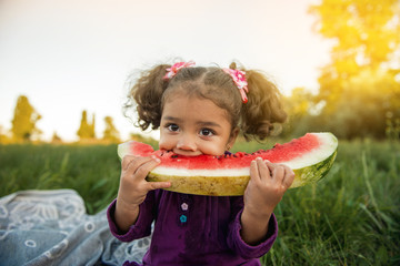 happy child eating watermelon