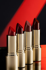 Golden lipsticks, red lipsticks