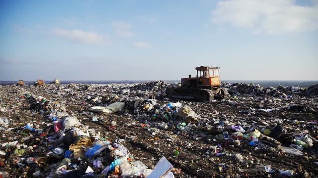 The bulldozer at work at the dump