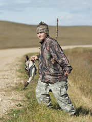 A young Duck Hunter with a Drake Pintail in North Dakota