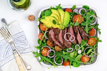 Steak salad on the white background. Steak salad isolated. Top view