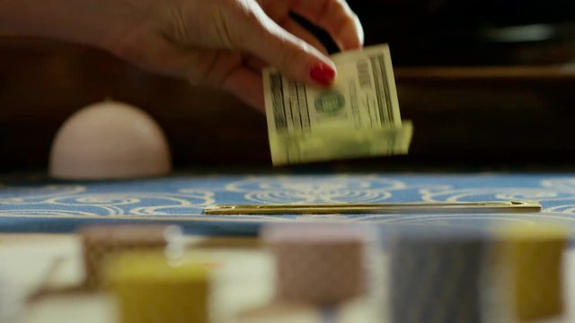 Dealer tip in casino. Shot in slow motion.