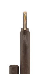 Wooden ball pen with a tube for storage on a white background