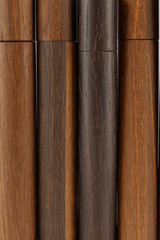 Wooden ball pen with a tube for storage on a white background