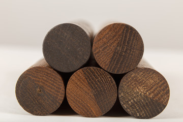 Wooden ball pen with a tube for storage on a white background