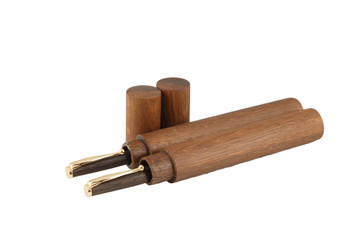 Wooden ball pen with a tube for storage on a white background