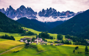Fototapeta na wymiar Famous best alpine place of the world, Santa Maddalena (St Magdalena) village with magical Dolomites mountains in background, Val di Funes valley, Trentino Alto Adige region, Italy, Europe