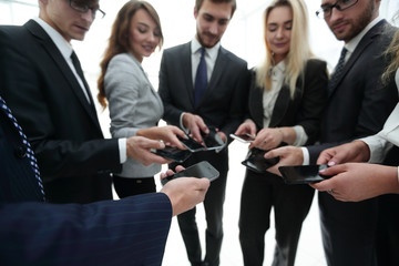 close-up of smartphones in the hands of business youth