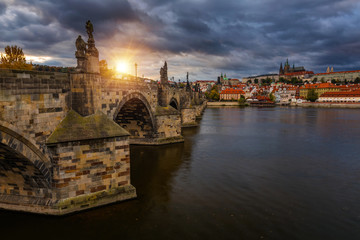 Fototapeta premium Famous Charles bridge in the sunset light, beautiful scenary and one of the iconic landmarks in Prague. Czech Republic.