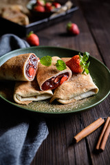 Sweet baked Chimichangas with strawberry filling